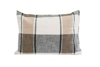 A white, gray and tan plaid sham pillow.