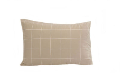 A tan pillowcase with a white grid pattern design.