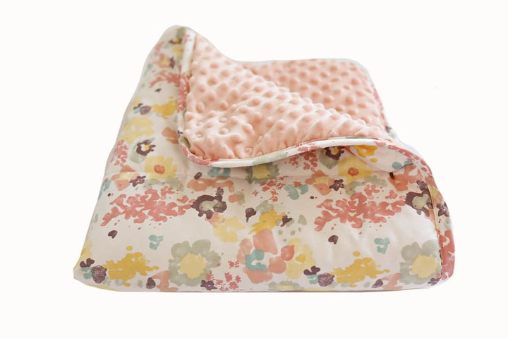 Floral pattern mini blanket with pink minky interior 