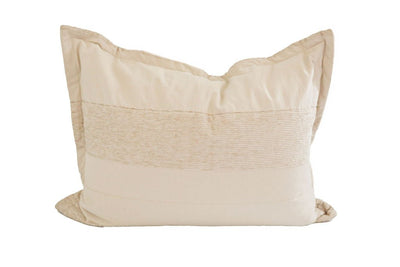 A tan sham pillow with faint stitched horizontal lines.