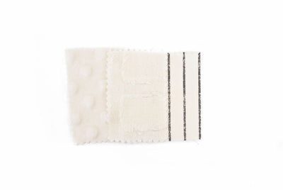 Close up of cream zipper bedding fabric sample