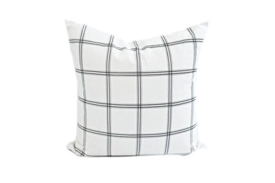 white and gray grid pattern pillow