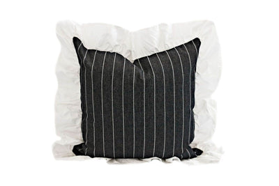 charcoal striped pillow with white ruffle along the edge