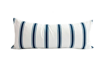 White and navy blue striped lumbar pillow.