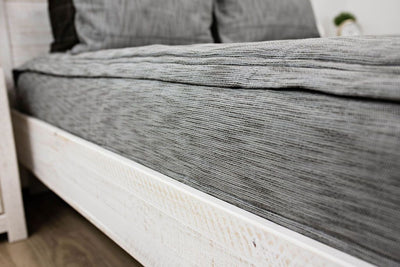 side of woven gray and brown textured bedding