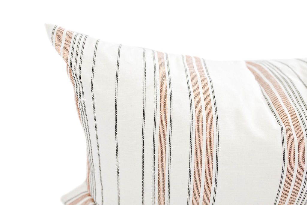 Enlarged view of a cream and cognac striped lumbar pillow.