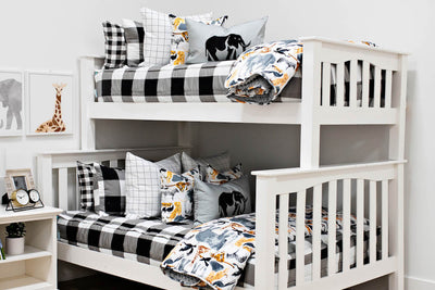 bunk bed with Black and white buffalo plaid bedding white and black grid patterned euro, safari animal print pillow, gray lumbar with embroidered elephant and safari animal print blanket