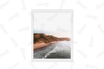 An island with a beach at sunset digital artwork showcased in a frame.