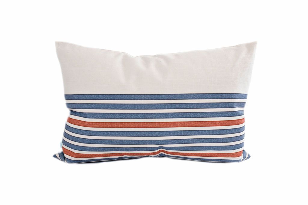 Cream lumbar pillow with blue and orange stripes
