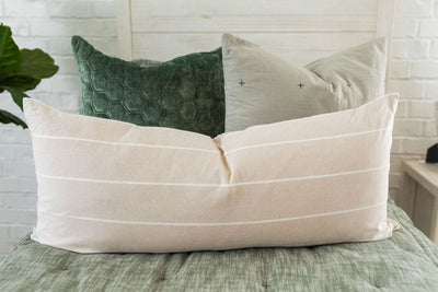 Green zipper bedding with matching pillows, green velvet hexagon pattern pillow and matching blanket, and cream lumbar pillow