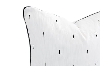 Close up of white pillow with black line pattern