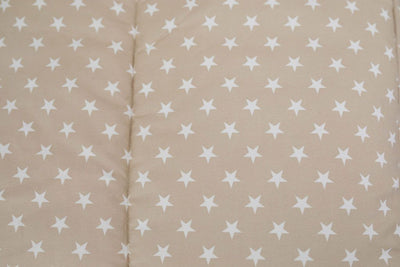 A close up of the interior of a set of light tan cars kids zipper bedding.