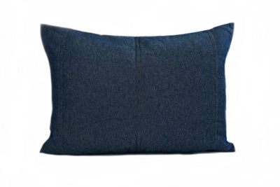 A denim blue pillow sham on a white background.