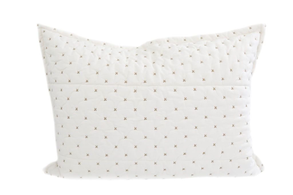A cream sham pillow with light brown stitching.