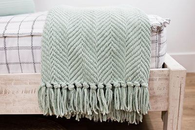 sage green knitted chenille throw