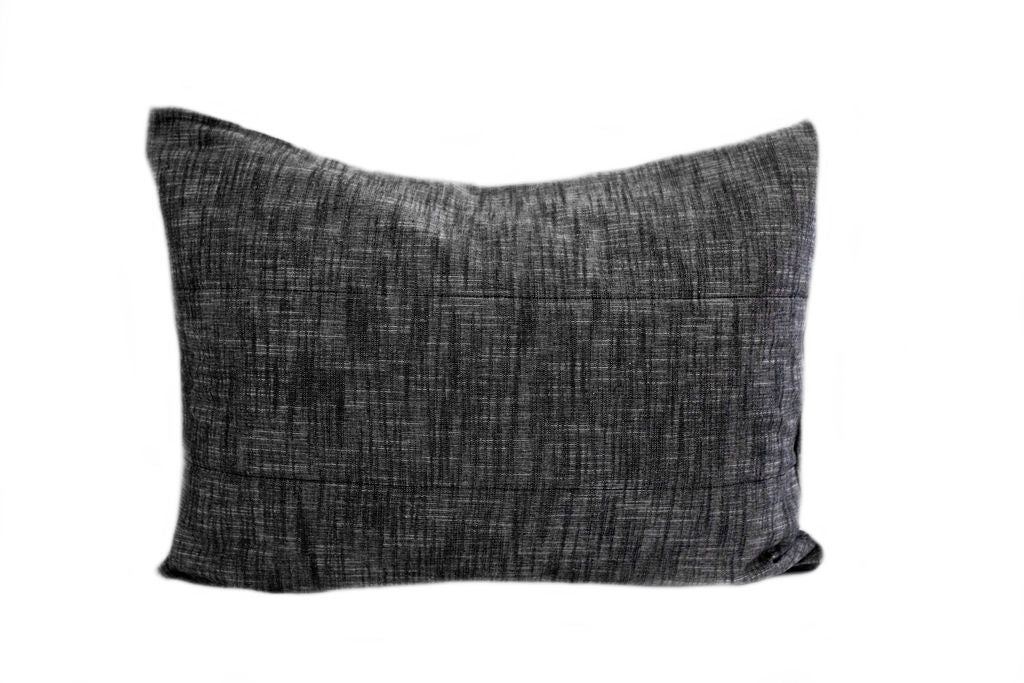 A charcoal gray pillow sham.