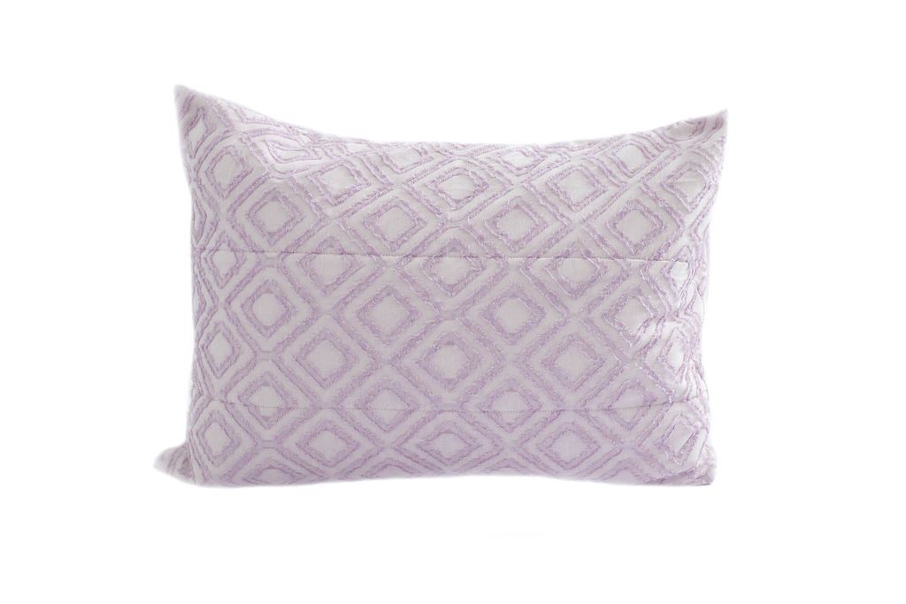 A purple textured pillow sham. 