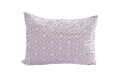 A purple textured pillow sham. 