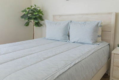 Blue zipper bedding with matching pillows