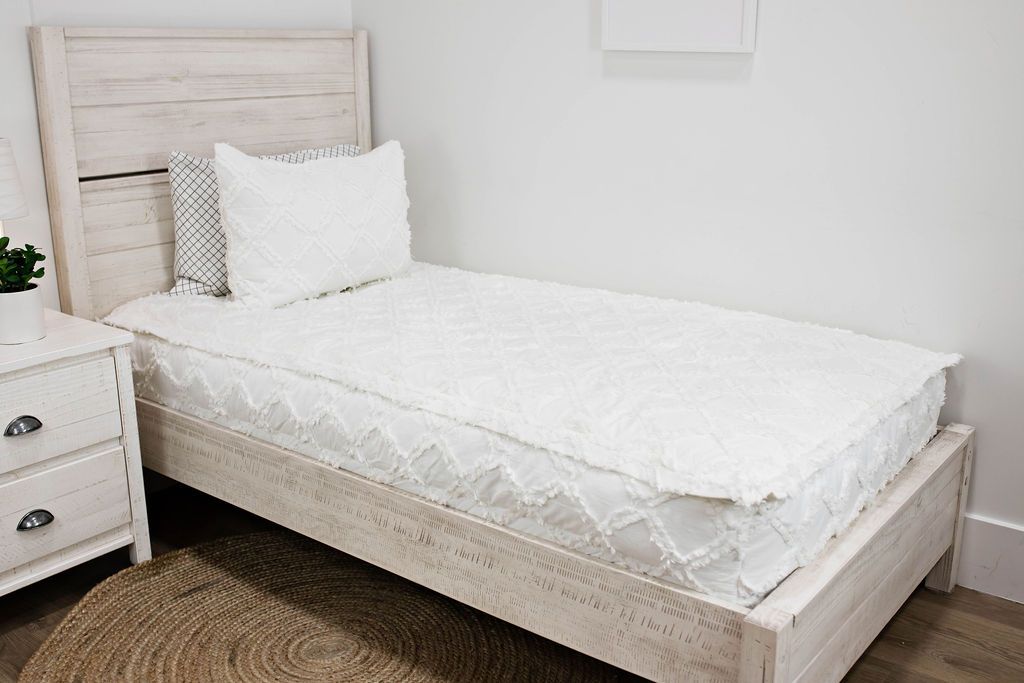 White bedding with textured diamond design