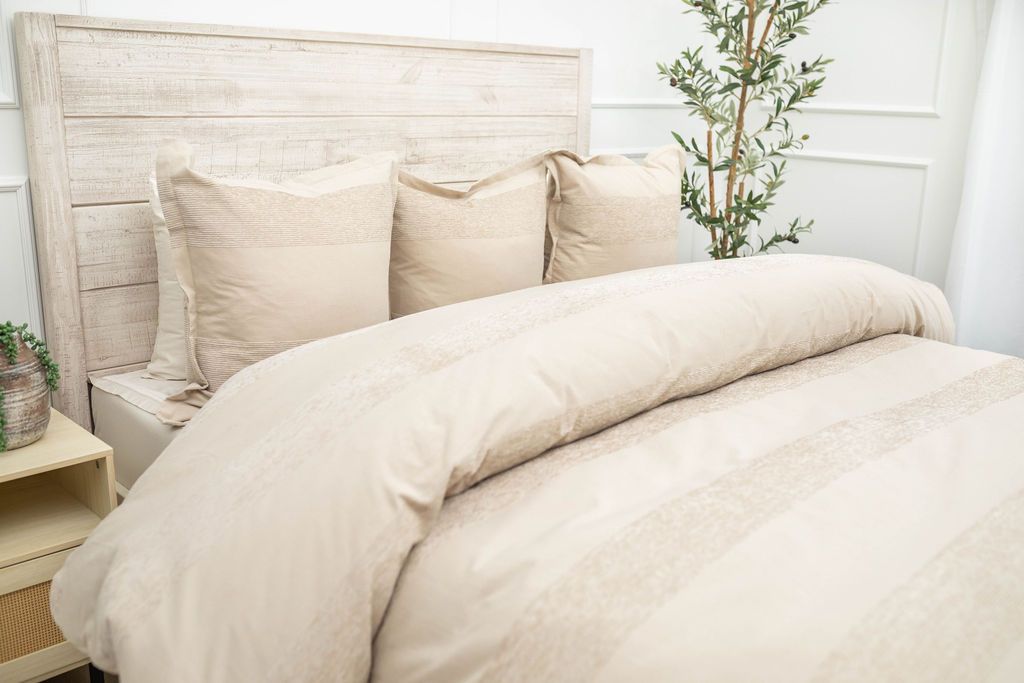 Tan duvet bedding styled with matching euro pillows