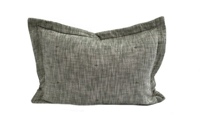 A dark green pillow sham with a small stitch design.