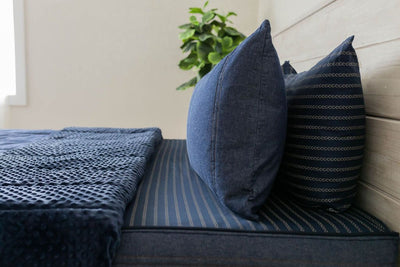 Unzipped Dark blue zipper bedding revealing minky inner lining. Decorated with matching pillow cases and shams.