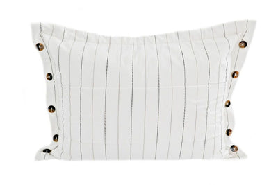 A white sham pillow with a vertical pin stripe design and brown buttons.