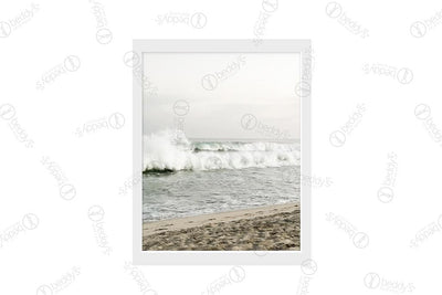 A beach with a wave coming into the sand digital artwork showcased in a frame. 