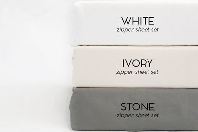 An infographic labeling the color options for zipper sheet sets which includes white, ivory, and stone.
